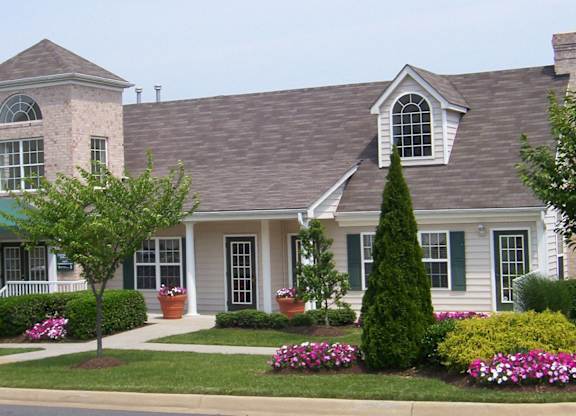 A house with a grey roof and a white front porch.at Summerland Heights, Woodbridge, 22191  