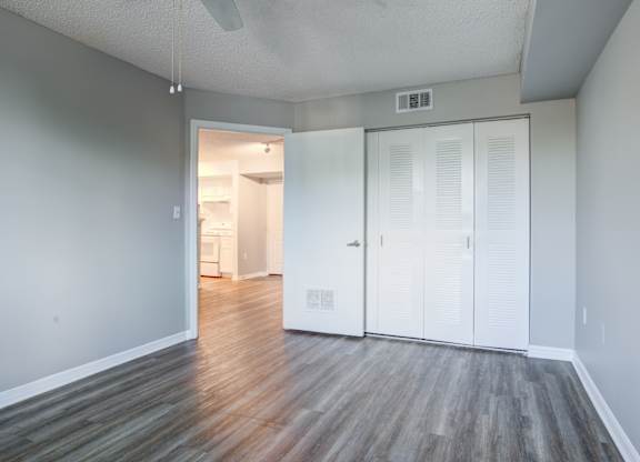 A room with a white ceiling and a white door.
