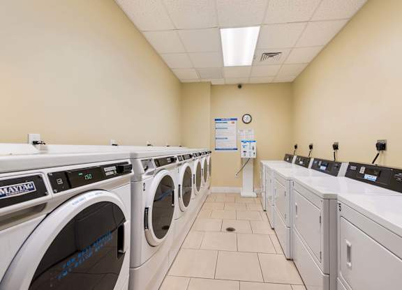 A row of washing machines in a laundromat.