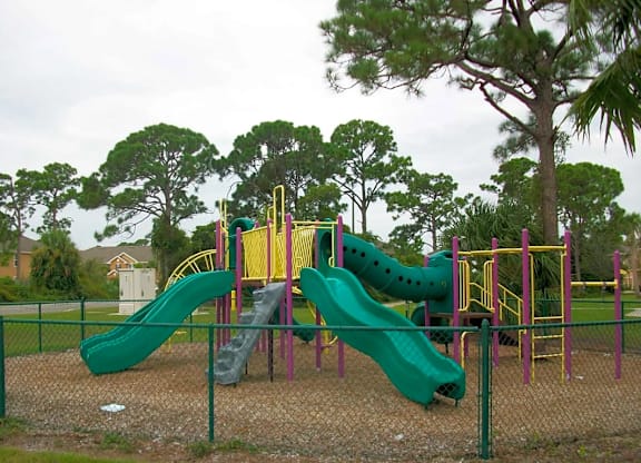 a playground with slides at a park