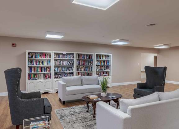 Bookshelf And Living Area at River Run Senior Apartments, Woodbridge, VA