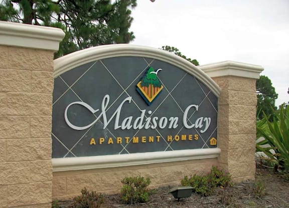 a sign at the entrance apartment lodges