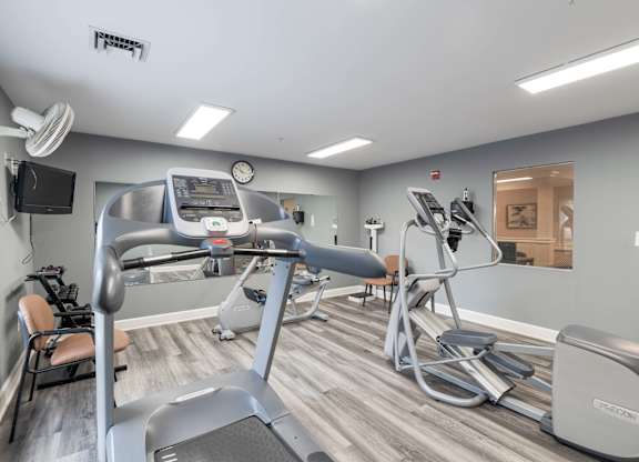Gym with treadmills, elliptical machines, and other exercise equipment at Gardens of Traville, Rockville, MD, Maryland
