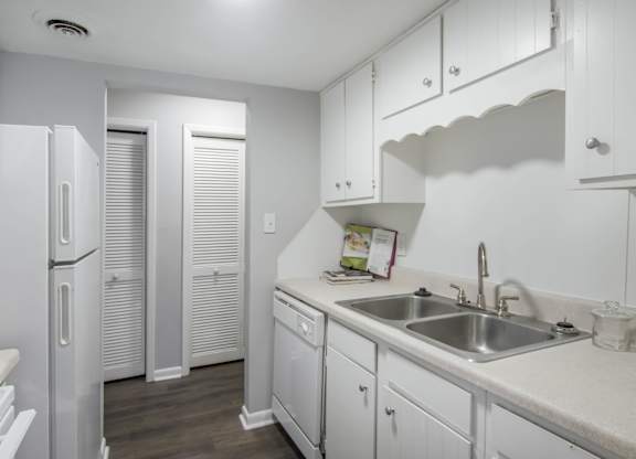 Kitchen With White Cabinetry And Appliances at Gates at Summerville, Summerville