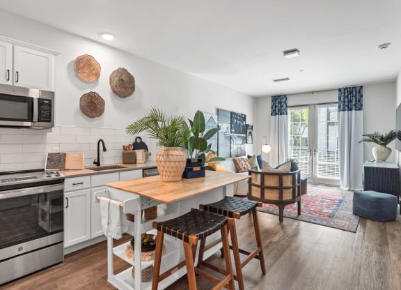 an open kitchen and living room with a dining room table at Casa Marti, Tampa, 33605