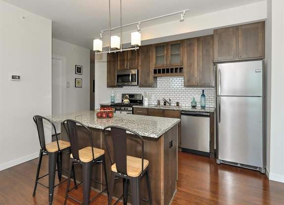 Fitted Kitchen With Island Dining at Bluestone Flats, Minnesota