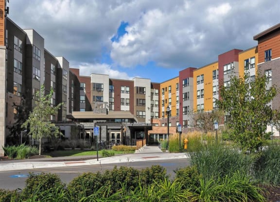 a row of new apartment buildings on a city street at Bluestone Lofts, Duluth, MN 55803