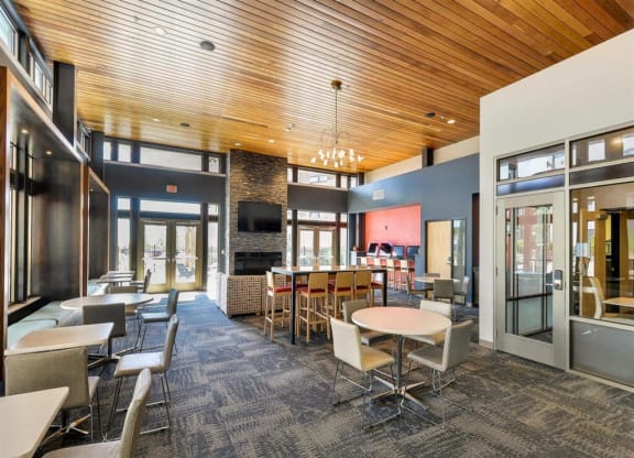 a large dining room with tables and chairs at Bluestone Lofts, Duluth