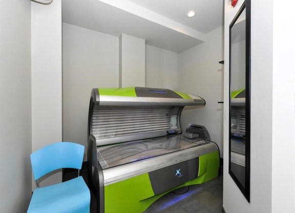 a room with an open printer and two blue chairs at Bluestone Lofts, Duluth