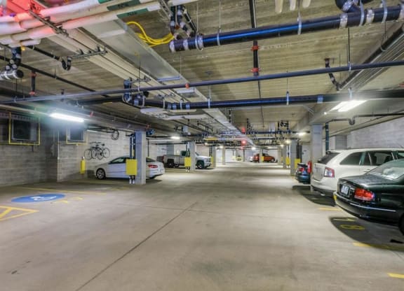 a parking garage with cars parked in it at Bluestone Lofts, Minnesota, 55803