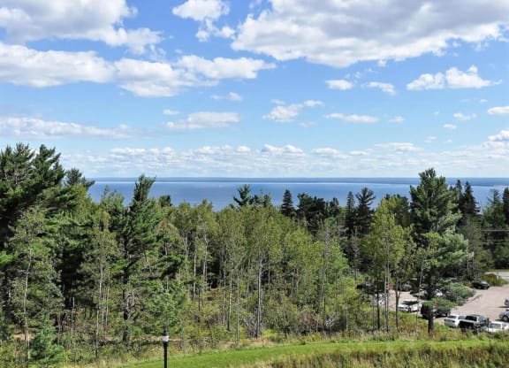 a view of the lake from the top of a hill at Bluestone Lofts, Duluth, 55803