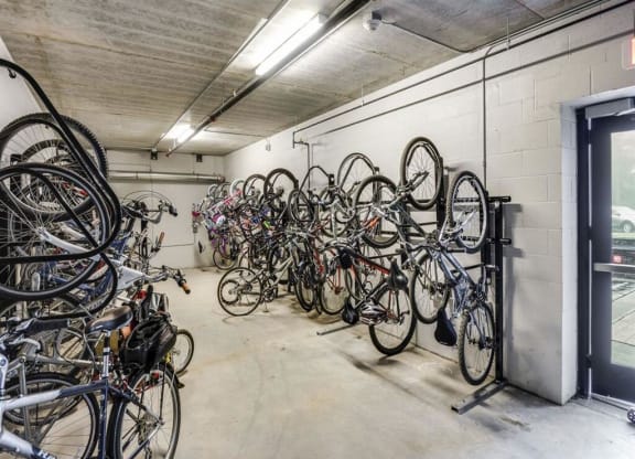 a bunch of bikes are hanging on a wall in a room at Bluestone Lofts, Duluth, MN 55803