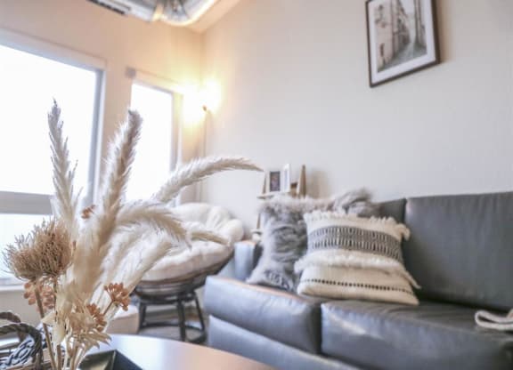 a living room with a couch and a table at Bluestone Lofts, Duluth