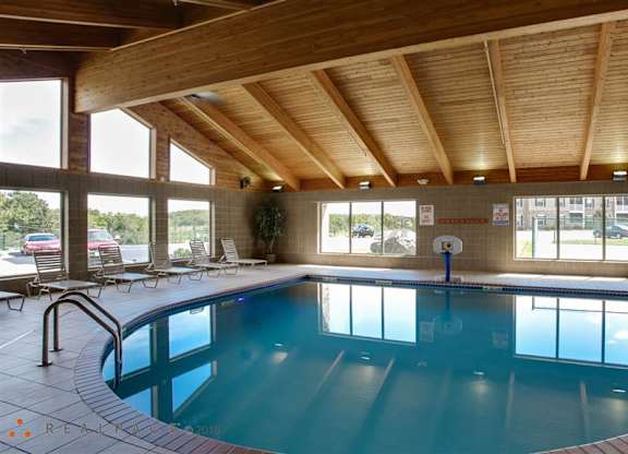 a swimming pool under a wooden ceiling in a hotel at Boulder Ridge, Duluth, 55811