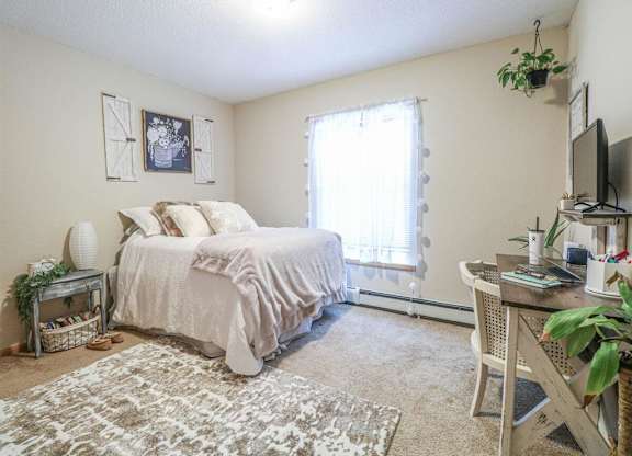 a bedroom with a bed and a tv at Boulder Ridge, Duluth, 55811