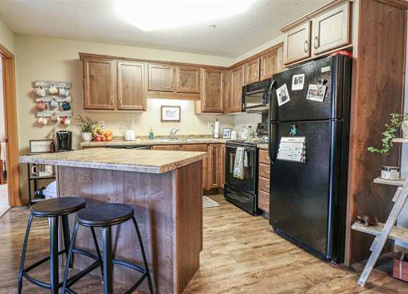 a kitchen with a counter top and a refrigerator at Boulder Ridge, Minnesota, 55811