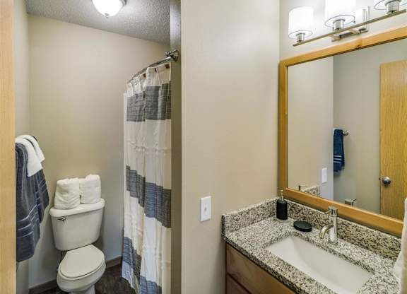 a bathroom with a large mural on the wall at Campus Park, Duluth, 55811