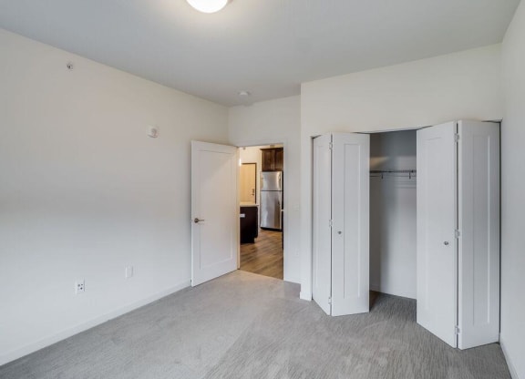 a bedroom with white walls and a closet at Arbor Ridge, Minnesota, 55025