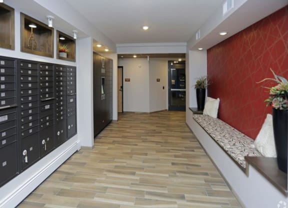 a lobby with a locker room and a wooden floor at Arbor Ridge, Minnesota, 55025