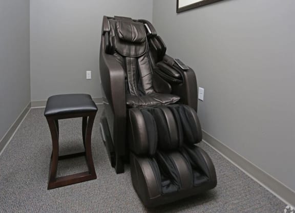a massage chair and a stool in a room at Arbor Ridge, Forest Lake, 55025