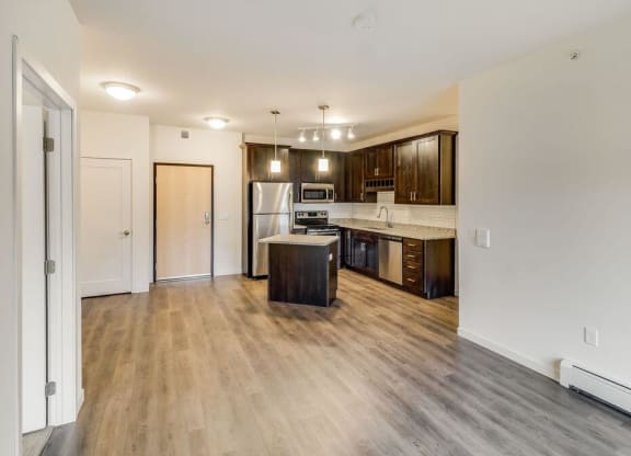 a kitchen with a stove and a refrigerator at Arbor Ridge, Forest Lake, 55025