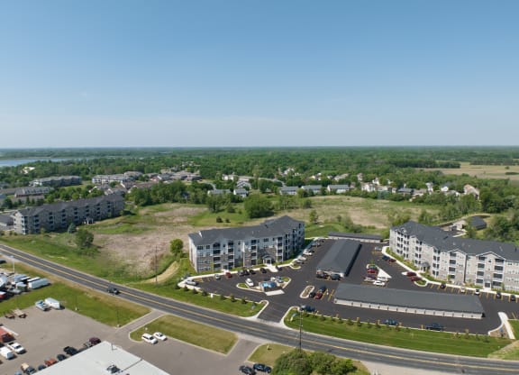 an aerial view of a city with buildings and roads  at Timber Ridge, Minnesota, 55025