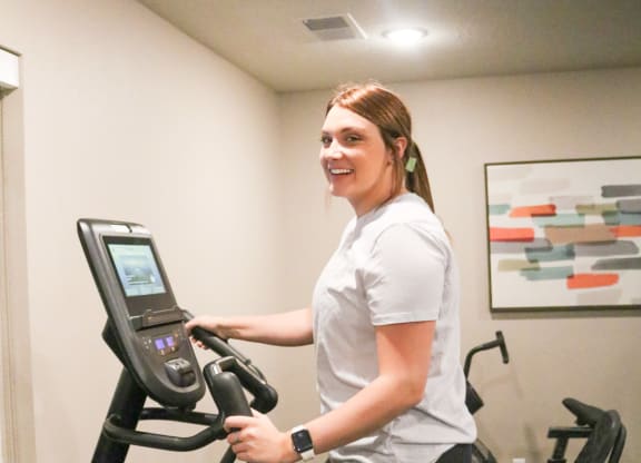 a woman running on a treadmill at the gym  at Timber Ridge, Forest Lake, MN