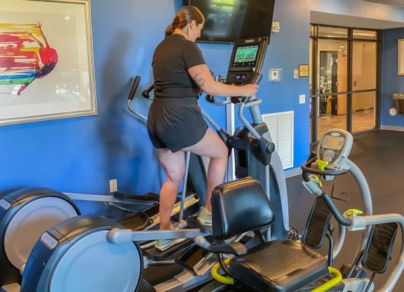 a woman running on a treadmill in a gym  at Timber Ridge, Minnesota