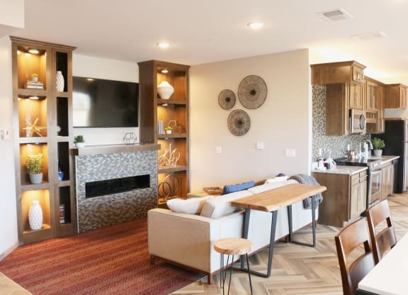a living room with a couch and a table  at Timber Ridge, Forest Lake, MN, 55025