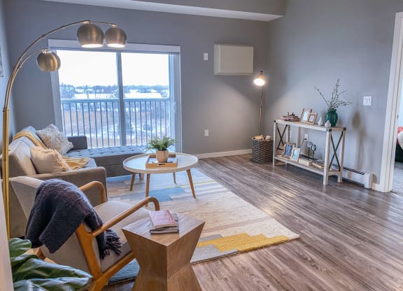 a living room with a large window and a couch  at Timber Ridge, Minnesota