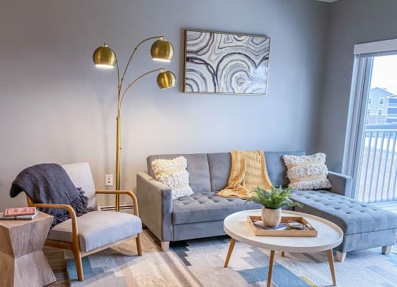 a living room with a couch and a coffee table  at Timber Ridge, Minnesota, 55025