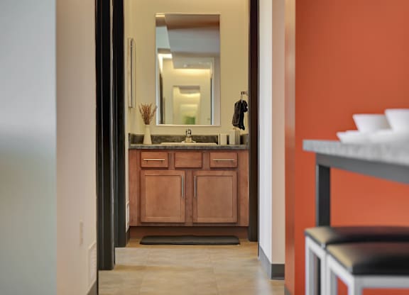 a view of a bathroom with a sink and a mirror at Parkhaus Apartments, Lincoln, Nebraska