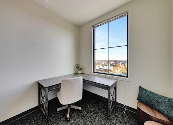 an office space with a desk and a window at Parkhaus Apartments, Lincoln, NE