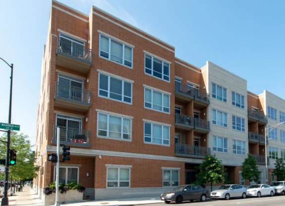 a large brick building with cars parked in front of it  at Tripp 4321, Chicago, 60641