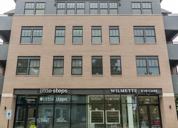 a large building with a store in front of it at Wilmette 1121, Illinois, 60091