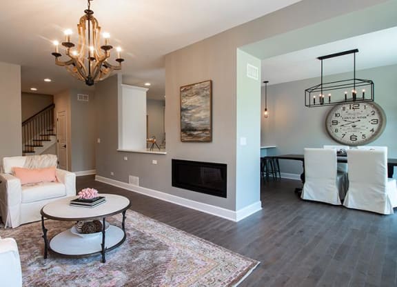 a living room with a fireplace and a table at Countryside Townhomes, Countryside, 60525