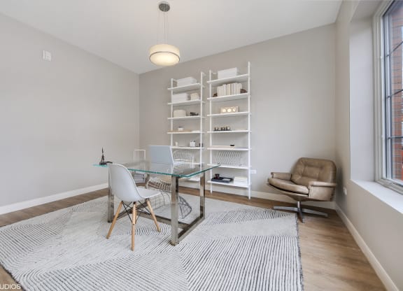 a home office with a glass desk and a chair at Clarendon Hills 229, Clarendon, IL 60514