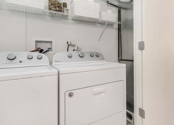 a white washer and dryer in a room next to a closet at Clarendon Hills 229, Clarendon, 60514