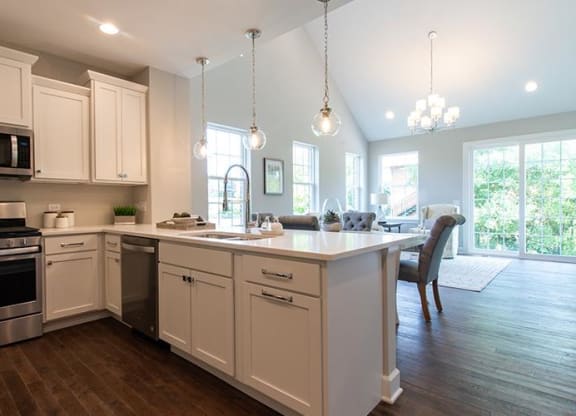 a kitchen with an island and a dining room at Countryside Townhomes, Countryside, 60525