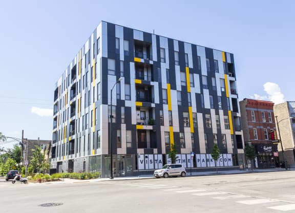 a new apartment building on the corner of a city street at Talman 1554, Chicago, 60622