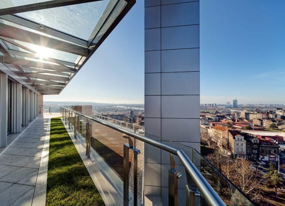a view of a city from a balcony of a building