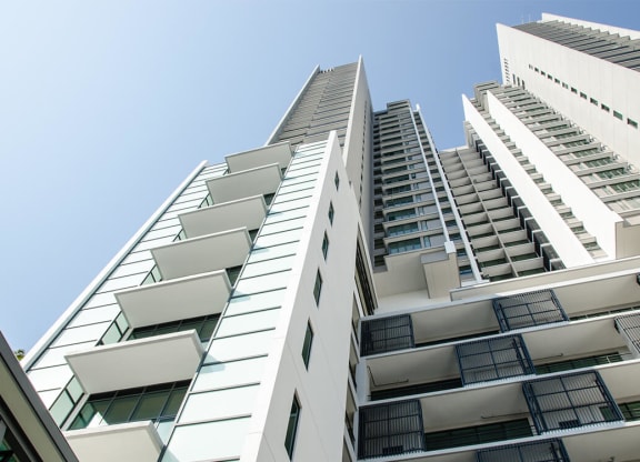a tall building with a blue sky in the background