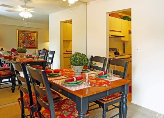 a dining room with a table and chairs