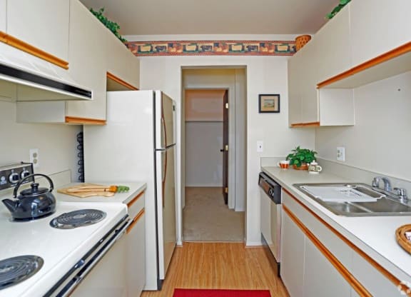 a kitchen with a sink and a refrigerator