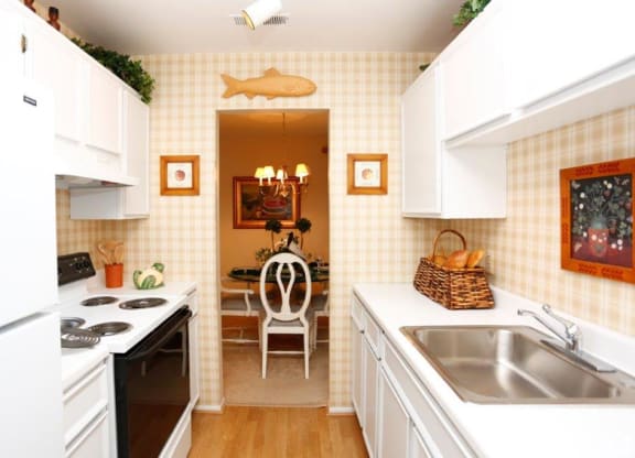 a kitchen with a sink and a table in it