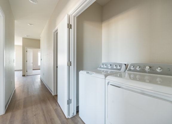 a room with a washer and dryer in it
