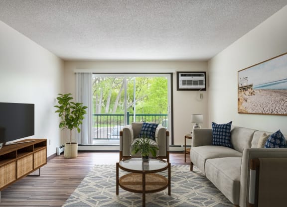 a living room with a large window and a sliding glass door