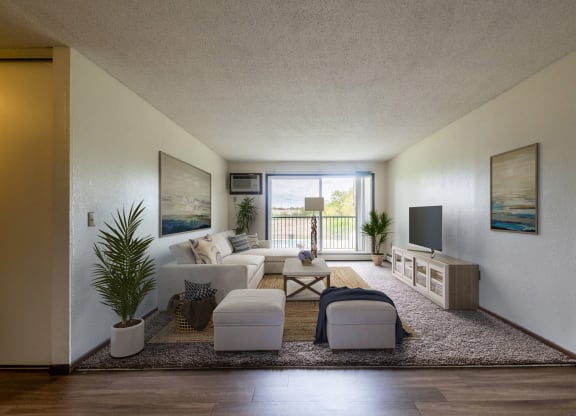 a rendering of a living room with a large window and a balcony