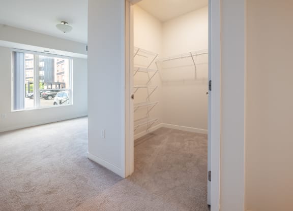 a walk in closet in a 555 waverly unit