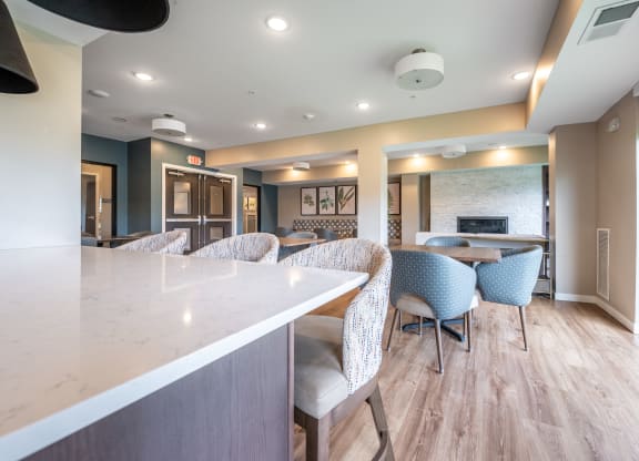 a resident clubhouse with a kitchen and dining area